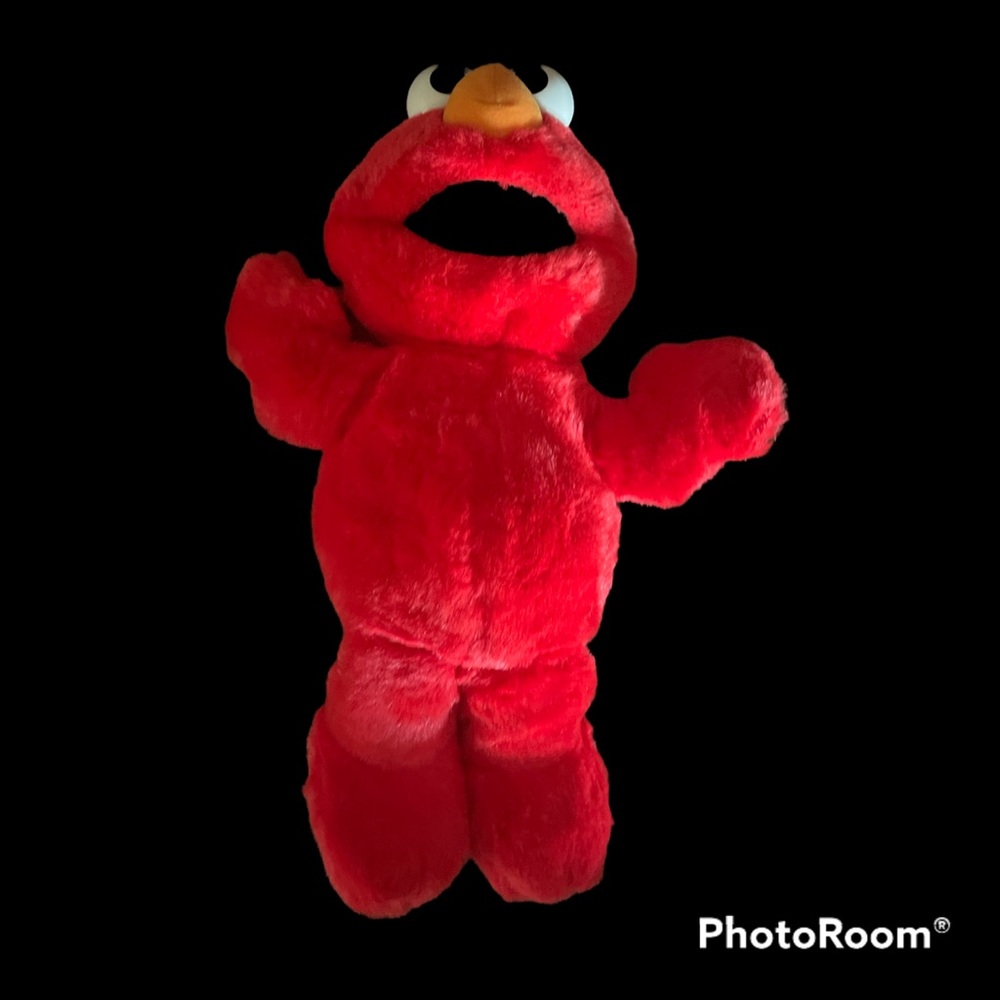 Elmo,Tickle Me Tyco plush toy. Squeezed, Elmo shakes, vibrates, recites.